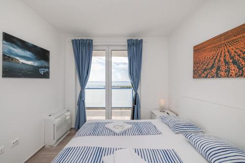 Ένα ή περισσότερα κρεβάτια σε δωμάτιο στο Villa Miri R1