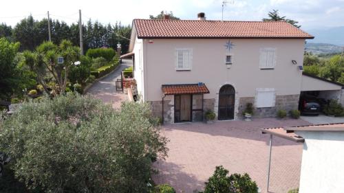 a white house with a red roof at casa di nunzia in Caiazzo