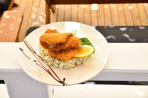 a plate of food with fish on top of mashed potatoes at MyElla Boutique Hotel in Mugla