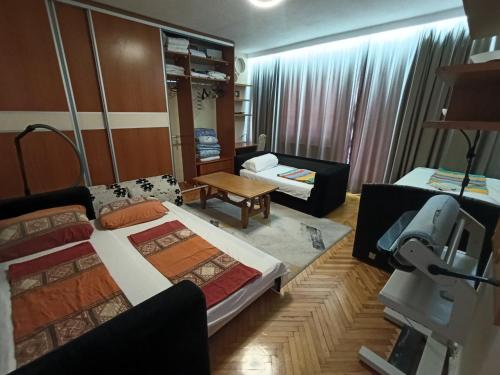 a living room with two beds and a couch at Apartment Tarik in Sarajevo