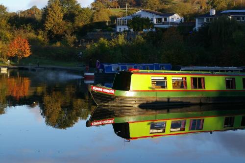 a yellow boat is sitting in the water at Stone - Boat - Sleeps 8 - Pet Friendly-85ws in Stone