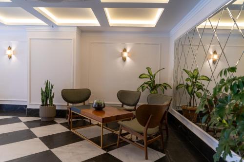 a meeting room with chairs and a table and plants at Brow City Kaş in Kas