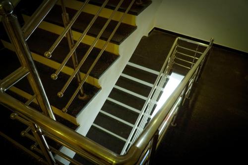 a set of metal stairs in a stair case at Hotel Jaisal Inn - Pure Veg in Jaisalmer