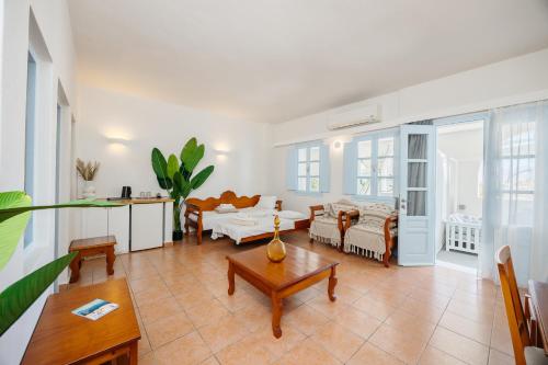 a living room with a couch and a table at Kastro Suites in Fira