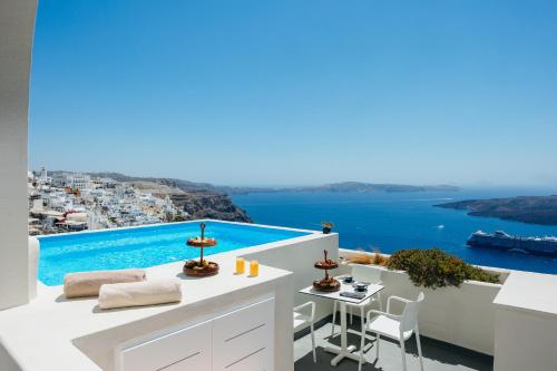 a view of the ocean from the balcony of a villa at Kastro Suites in Fira