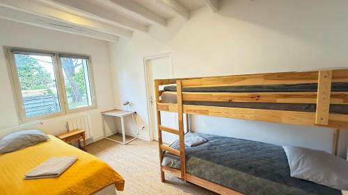 En eller flere senge i et værelse på Arcachon Bay Home with pool and jacuzzi beach Nearby