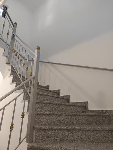 a set of stairs with a metal railing at Villa Eleni in Kypséli