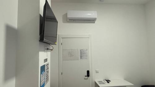 TV a/nebo společenská místnost v ubytování Bed&Breakfast Plaza de Toros Alicante