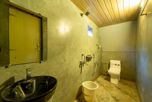 Vannituba majutusasutuses Dandeli Resorts - Luxury