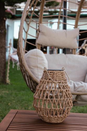 a wicker basket sitting on top of a wooden table at Evoikos beach & resort in Livanátai