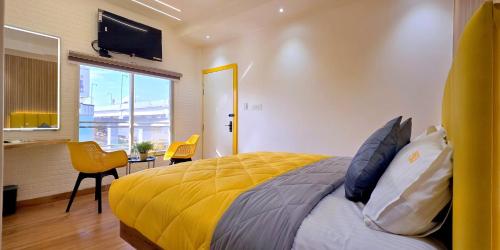 Postel nebo postele na pokoji v ubytování Stayinn Suites
