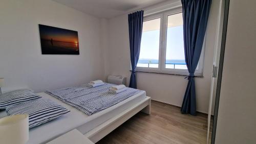 Ένα ή περισσότερα κρεβάτια σε δωμάτιο στο Villa Miri R2