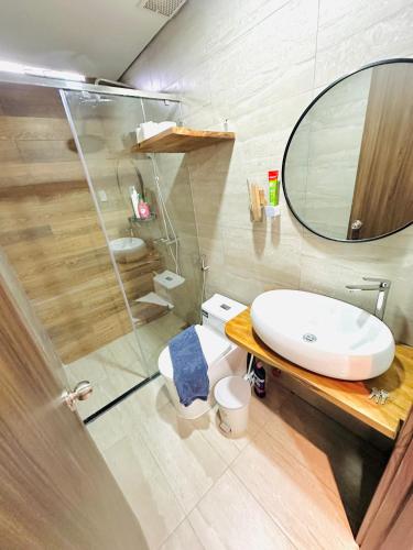 a bathroom with a sink and a shower and a toilet at 307MSNK Luxe Studio l Balcony & Kitchen in Can Tho