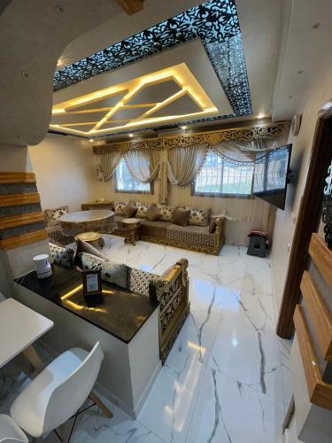 an aerial view of a living room with a marble floor at Appart Hicham in Tangier