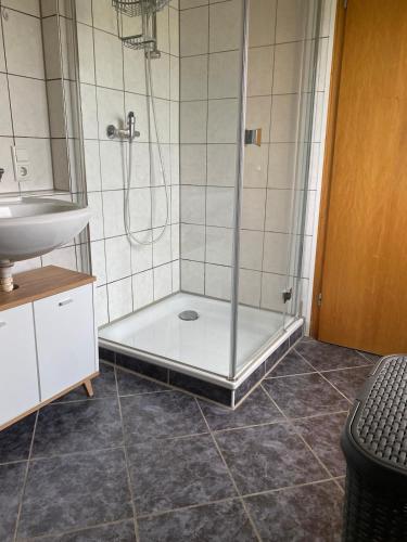 a bathroom with a shower and a sink at Gemütliche Wohnung in Xanten