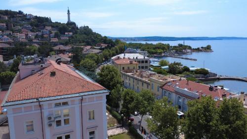 a view of a town and a body of water at Greif Hotel & Spa in Trieste