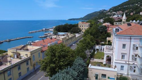 an aerial view of a town with a body of water at Greif Hotel & Spa in Trieste
