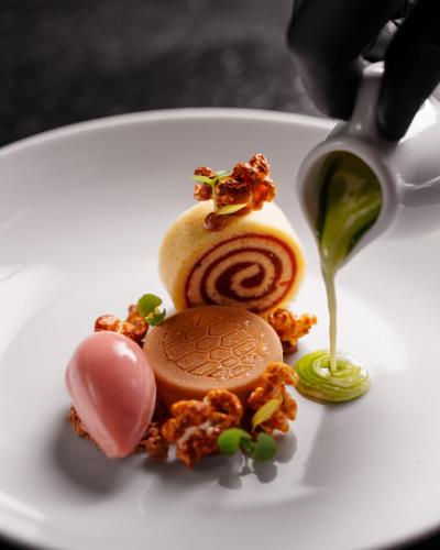a white plate with some food on it at Zendaya Resort Beach Sport & Spa in Búzios