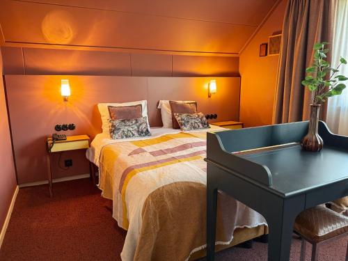 Postel nebo postele na pokoji v ubytování Hotel Restaurant Ruimzicht
