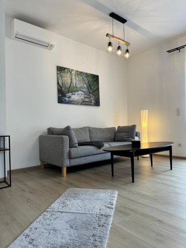 a living room with a couch and a table at Luxus Urlaub auf 1000 Meter im Erholungsparadies in Liebenau