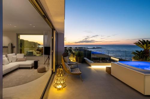 a living room with a view of the ocean at Opera Suite Hotel Pesaro in Pesaro