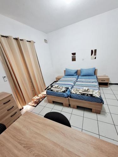 a bedroom with a bed in a room at Lovely Paceville Studio D in St. Julianʼs