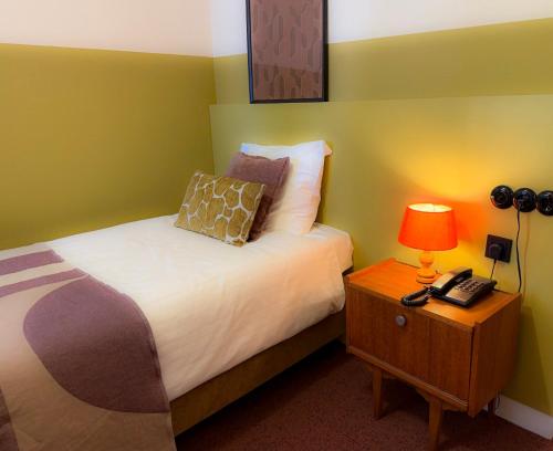Postel nebo postele na pokoji v ubytování Hotel Restaurant Ruimzicht