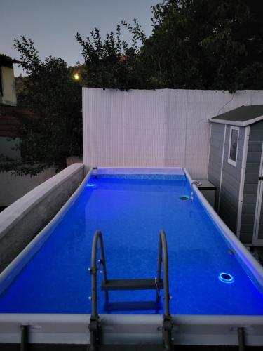 a large blue swimming pool on top of a building at Villa Rita in Cueva Grande