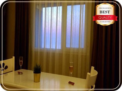 a room with a white table and a window at Silver Tower Family Apart Otel in Kuşadası