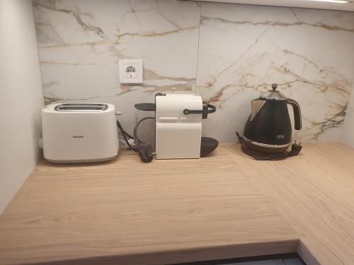 two toasters sitting on a counter in a kitchen at SzemesBay Apartment in Balatonszemes