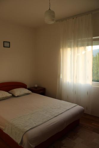 Ένα ή περισσότερα κρεβάτια σε δωμάτιο στο Verde Mostar