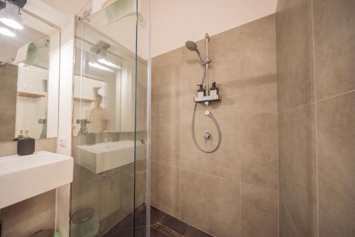 a bathroom with a shower and a sink at La Pupa coi baffi - Edificio Storico in Centro in Conversano