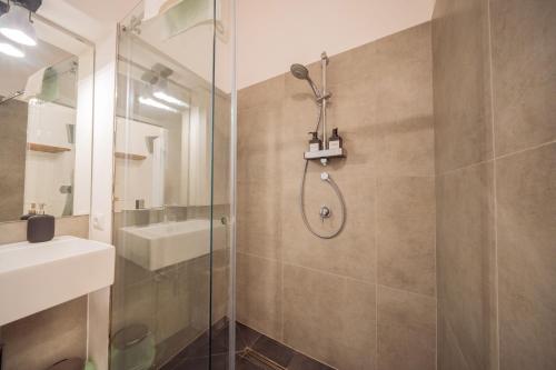 a bathroom with a shower and a sink at La Pupa coi baffi - Edificio Storico in Centro in Conversano