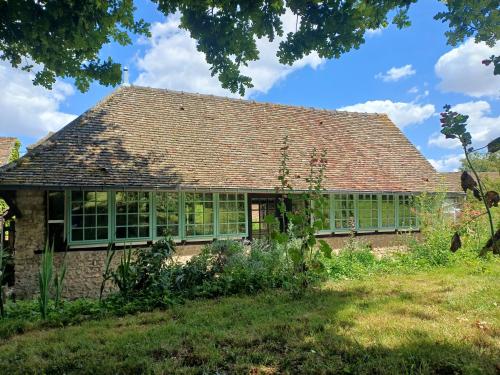 a house with a conservatory with green windows at French countryside near Paris! in Courcelles-lès-Gisors