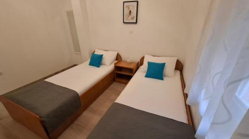 Postel nebo postele na pokoji v ubytování Apartments Rotim