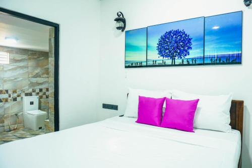 Ένα ή περισσότερα κρεβάτια σε δωμάτιο στο Sea Wind Villa