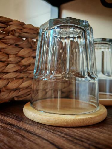 a glass jar sitting on top of a wooden table at La Banda Suites in Seville