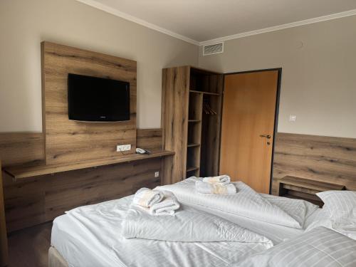 Ένα ή περισσότερα κρεβάτια σε δωμάτιο στο Der Marienhof Hotel Garni