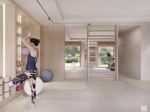 a woman is doing a pose in a room at Hotel Molo Resort in Osiek