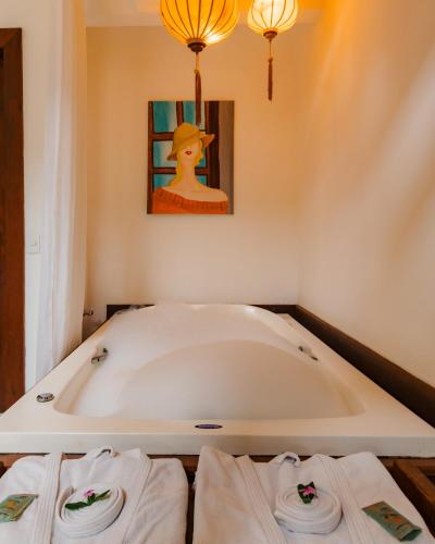 Ένα ή περισσότερα κρεβάτια σε δωμάτιο στο Le Village Boutique Hotel