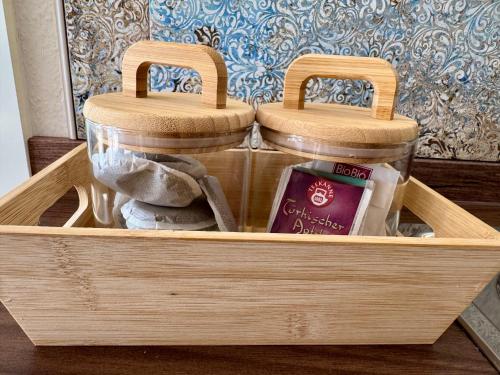 a wooden box with two wooden baskets in it at Heimatliebe in Neunkirchen