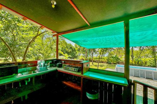 a view from the inside of a train car with at Beach cabinas on Playa Preciosa in Puerto Jiménez