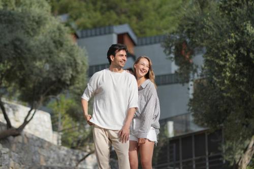 a man and a woman standing next to each other at Ramitos Hotel in Turunc