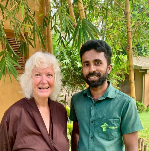 a man and an older woman posing for a picture at Ayuwaters Authentic Yoga and Ayurveda Retreat by the Bentota River All Inclusive in Bentota