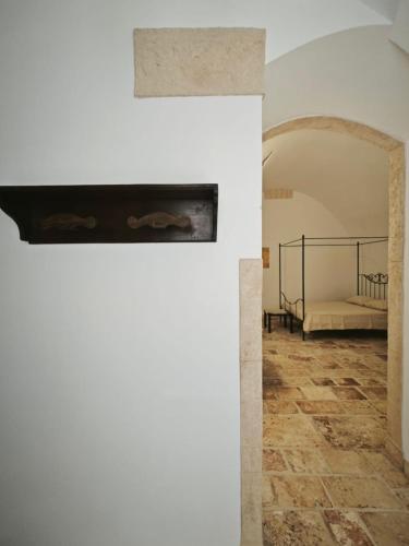 a view of a room with a bed in a building at CasaLina in Sammichele di Bari