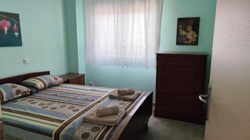 Кровать или кровати в номере Angela's House