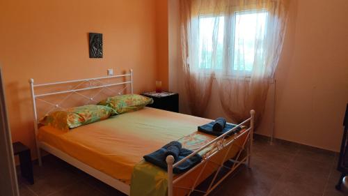 Кровать или кровати в номере Angela's House