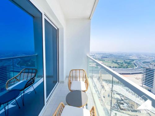 a balcony with chairs and a view of the city at City-View Studio in AG Tower l Pool & Gym Access in Dubai