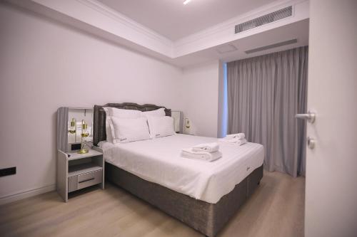 Ένα ή περισσότερα κρεβάτια σε δωμάτιο στο Diamond Titanic Resort