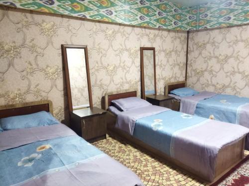 Katil atau katil-katil dalam bilik di Hotel Tashkent Muhammad